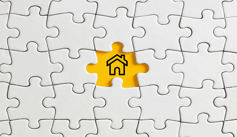 House icon on missing puzzle piece. Seraching for a house for rent or sale concept.