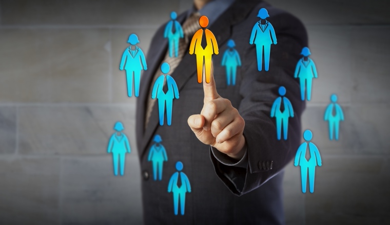 Blue chip business man is choosing one male in a crowd of male and female worker icons. Concept for business partnership, HRM, finding the right customer, leadership, promotion, recruiting and CRM.