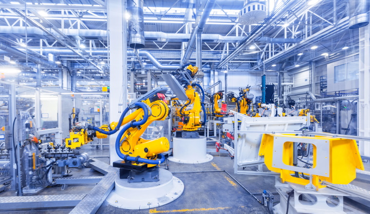 robotic arms in a car plant